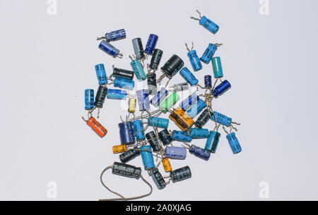 close up of differant type of electrolytic capacitors isolated on white background. Stock Photo