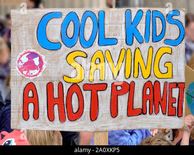 Placard 'Cool kids saving a hot planet' on global climate strike in Berlin, Germany Stock Photo