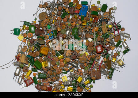 close up of pile of defferent types of ceramic capacitors isolated on white background. Stock Photo