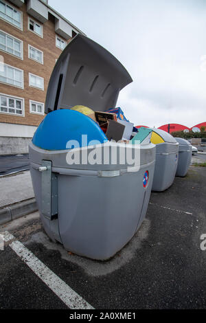 Coruna / Spain - September 20 2019: Cardboard recycle bin overflowing with waste cardboard in Coruna Spain Stock Photo