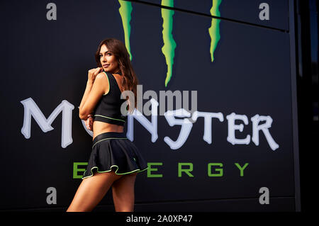 22nd September 2019; Ciudad del Motor de Aragon, Alcaniz, Spain; Aragon Motorcycle Grand Prix, Race Day; a Monster Energy paddock girl poses during the Warm Up Stock Photo
