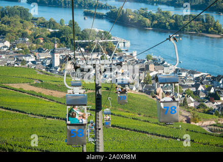 21 September 2019, Hessen, Rüdesheim: Tourists sit in the cable car to the Niederwald monument. Photo: Andreas Arnold/dpa Stock Photo