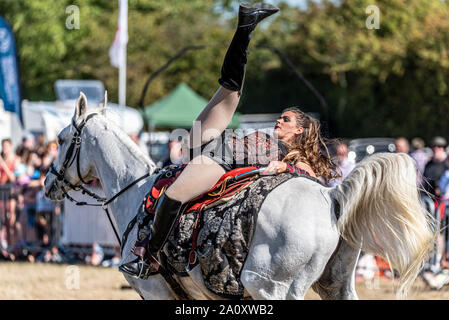 Equestrienne Stunt Shows horse display at the National Country Show Live at Hylands Park, Chelmsford, Essex, UK. Horse event team Stock Photo