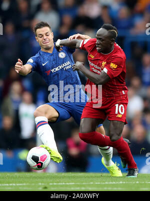 Chelsea's Cesar Azpilicueta (left) and Liverpool's Sadio Mane (right) battle for the ball during the Premier League match at Stamford Bridge, London. Stock Photo