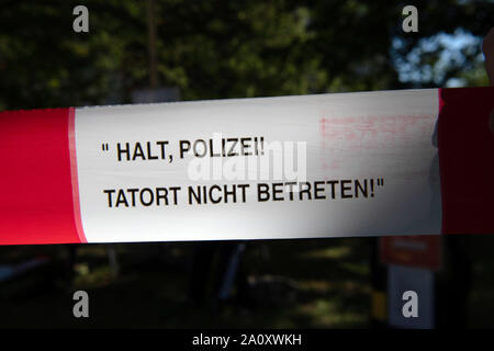 Berlin, Germany. 22nd Sep, 2019. A barrier tape hangs between trees at the open house of the Berlin police. Credit: Paul Zinken/dpa/Alamy Live News Stock Photo