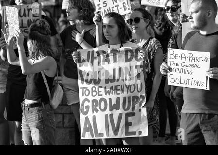 Millennial protesters hold signs at the International Justice Rally in Asheville, NC, USA Stock Photo