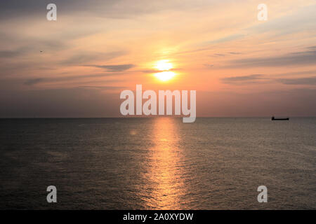 Beautiful view of the sunset at Scheveningen beach. This picture was taken from the pier at Scheveningen strand in The Hague, South Holland. Stock Photo