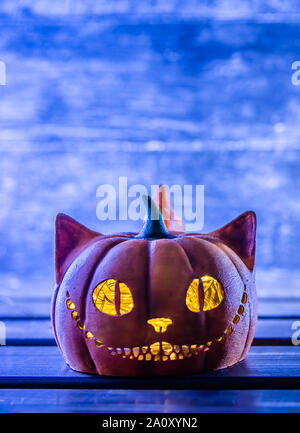 background for Halloween. orange pumpkin Cheshire cat. copy space