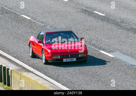 1990 red Ferrari; UK Vehicular traffic, transport, modern, saloon cars, south-bound on the 3 lane M6 motorway highway. Stock Photo
