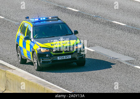 Tac ops, Lancashire Tactical Operations division. UK Police Vehicular traffic, transport, modern, BMW saloon cars, north-bound on the 3 lane M6 motorway highway. Stock Photo