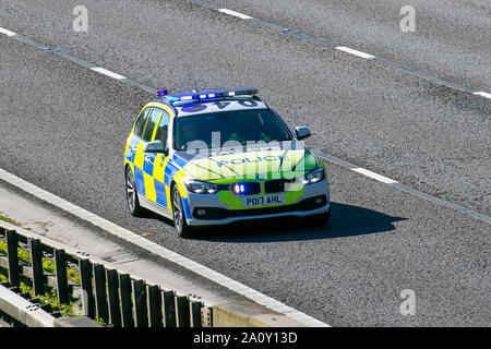 Tac ops, Lancashire Tactical Operations division. UK Police Vehicular traffic, transport, modern, BMW saloon cars, north-bound on the 3 lane M6 motorway highway. Stock Photo