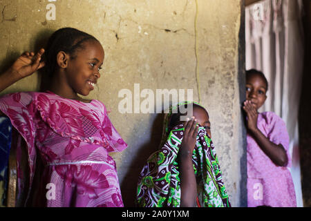 Veiled little girls laughing, Pemba island, Zanzibar Archipelago, Tanzania Stock Photo