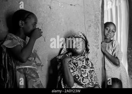 Veiled little girls laughing, Pemba island, Zanzibar Archipelago, Tanzania Stock Photo