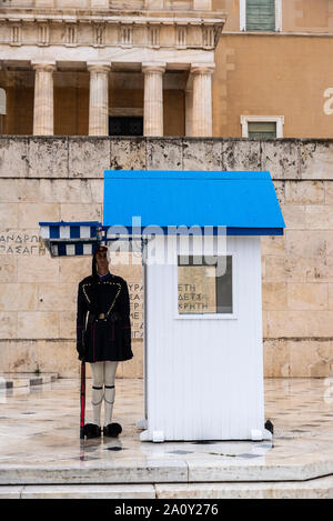 Athens, Greece - December 31, 2018: Greek Presidential Guard (Evzones) in front of the Hellenic Parliament and the Tomb of the Unknown Soldier in Athe Stock Photo