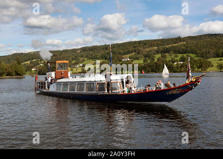 The steam yacht Gondola owned by the National Trust carries visitors on Coniston Water in the English Lake District. Stock Photo