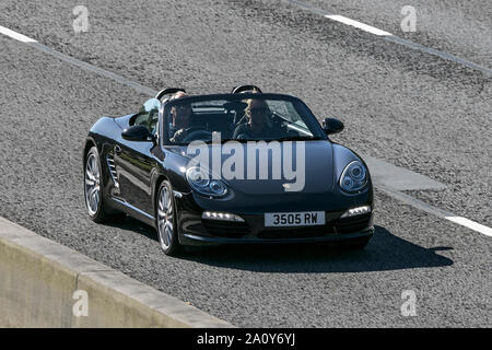 A porsche 911 convertible travelling northbound on the M6 motorway near Garstang in Lancashire, UK. Stock Photo