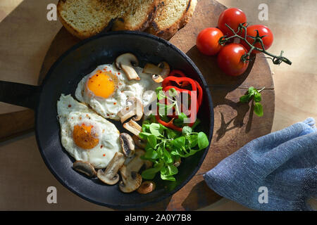 Fried Eggs And Vegetables In A Frying Pan Stock Photo