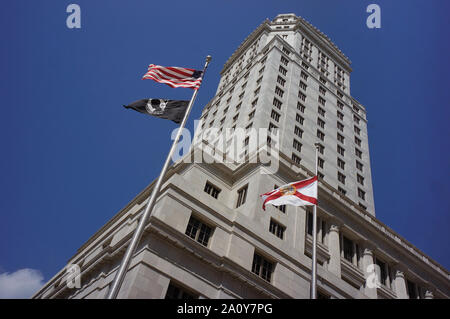 Historic Miami-Dade County Courthouse building in downtown Miami. The black flag in the picture is POW/MIA flag Stock Photo