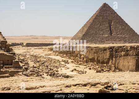 The Pyramid of Menkaure is the smallest of the three main Pyramids of Giza, located on the Giza Plateau in the southwestern outskirts of Cairo, Egypt. Stock Photo
