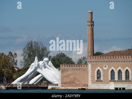 Architectural art installation entitled 'Building Bridges' by Lorenzo Quinn, Venice, Italy Stock Photo