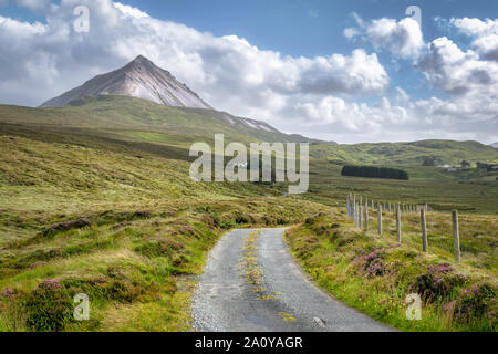 A remote country road that leads up to Mount Errigal in County Donegal Ireland Stock Photo