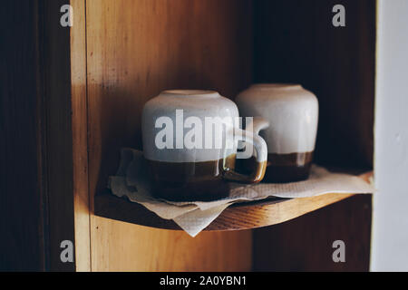 Vintage Coffee Cups on Shelf Stock Photo