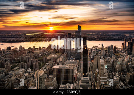 View across New York City at midtown Manhattan and the Hudson river at sunset from the Empire State Building Stock Photo