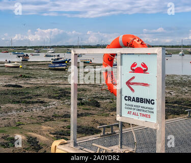 WEST MERSEA, ESSEX, UK - AUGUST 31, 2018:  Sign for Crabbing on the Jetty on the River Blackwater Stock Photo