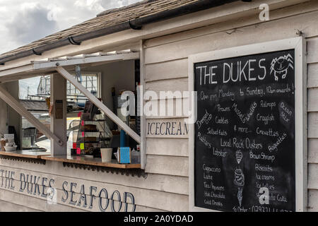 WEST MERSEA, ESSEX, UK - AUGUST 31, 2018:  The Dukes Seafood Shack with menu board Stock Photo