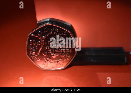 2019 released Peter Pan uncirculated 50p with mirror reflection and a colourful background. Stock Photo