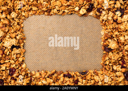 Frame of homemade granola with copy space for text or design. Horizontal composition. Tasty breakfast cereals Stock Photo