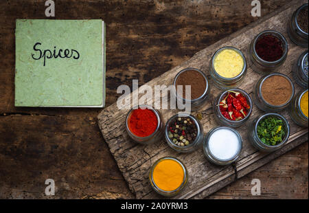 Large collection of spices and food ingredients in small bowls Stock Photo
