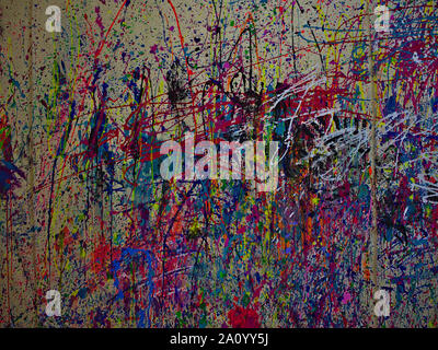Paint splattered on a cloth background while making spatter art. In an artist studio. This is NOT the art. 1 of 3. Stock Photo