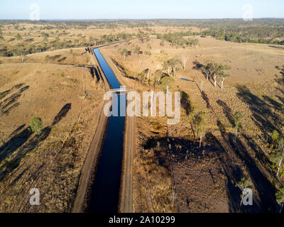 The open irrigation channel that feeds the irrigation channels around the Gin Gin area from Lake Monduran Queensland Australia Stock Photo