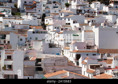 Cottages with white walls located on mountain slope on sunny day in resort town in Mijas, Malaga, Costa del Sol, Spain Stock Photo