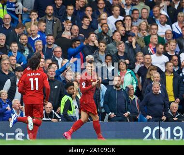 London, UK. 23rd Sep, 2019. Liverpool's Roberto Firmino (R) celebrates during the English Premier League match between Chelsea and Liverpool at Stamford Bridge in London, Britain on Sept. 22, 2019. Credit: Xinhua/Alamy Live News Stock Photo