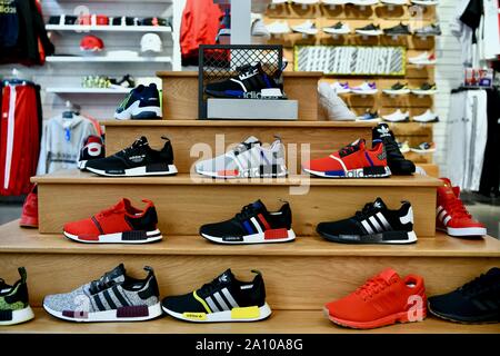 Adidas shoes in the Adidas in York City, USA Stock Photo -