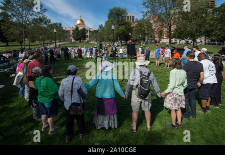 Boston, Massachusetts, USA. 22 September, 2019.  10th  annual United Nations International Day of Peace and Climate Action on the Boston Common.  About 100 people gathered on the Boston Common below the Massachusetts State House in central Boston, MA.