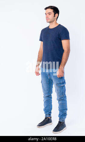 Full body shot of young handsome Persian man Stock Photo
