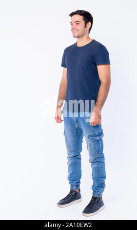 Full body shot of young handsome Persian man Stock Photo