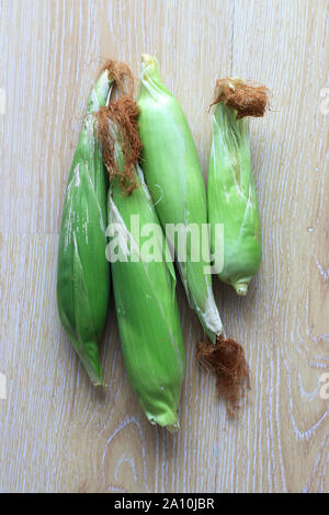 Fresh corn on wooden background Stock Photo