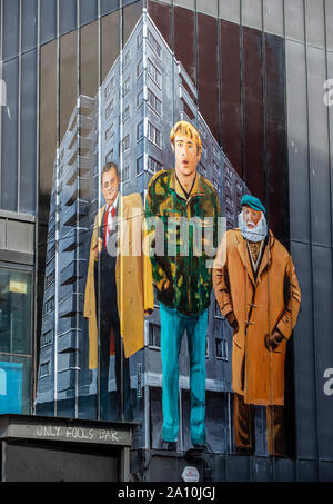 A mural depicting Del Boy, Rodney and Uncle Albert from Only Fools and Horses painted on the side of a building in Liverpool. The streets of the city have been transformed with bursts of colour as artists make their mark. Stock Photo