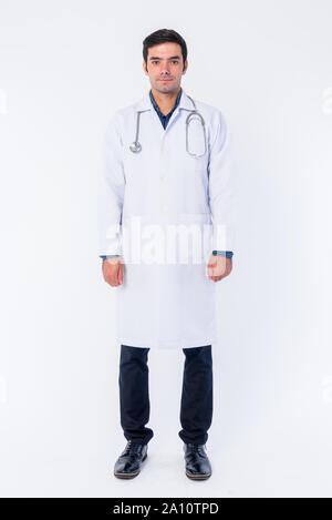 Full body shot of young Persian man doctor Stock Photo