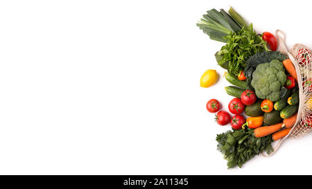 Fresh and colorful vegetables inside eco bag on white Stock Photo