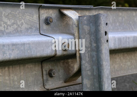 Barrier, designed to prevent the exit of the vehicle from the curb or bridge, moving across the dividing strip Stock Photo