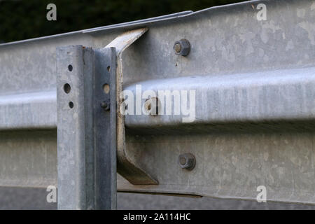 Barrier, designed to prevent the exit of the vehicle from the curb or bridge, moving across the dividing strip Stock Photo