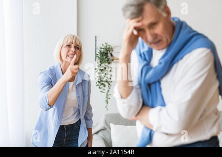 Senior couple having relationship problems, quarrelling at home Stock Photo