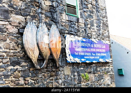 Smokehouse with kipper sign on wall, Craster, Northumberland, England, fish smokers, smokehouse sign, smoked kippers, Craster Northumberland, sign Stock Photo