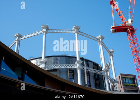 Gasholders building: block of flats, built inside disused historic Victorian gas holder in King's Cross, London UK. Photographed from Coal Drops Yard. Stock Photo