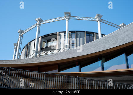 Gasholders building: block of flats, built inside disused historic Victorian gas holder in King's Cross, London UK. Photographed from Coal Drops Yard. Stock Photo